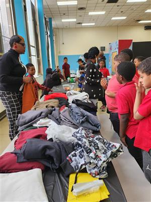 students receiving hoodies